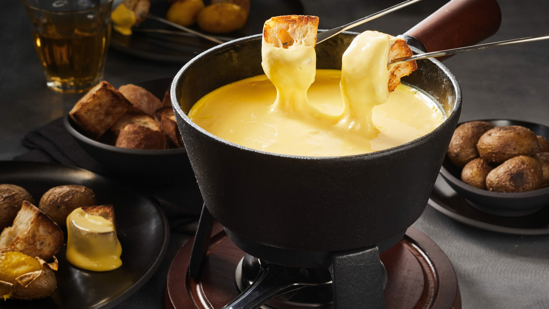 Delicious,Cheese,Fondue,With,Dipping,Forks,Coated,In,Melted,Cheese